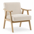 Sillón de salón tapizado en tejido beige con estructura de madera natural y reposabrazos estilo moderno