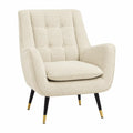 Silla butaca individual tapizada en tejido bouclé de poliéster crema con respaldo capitoné patas negras y remates dorados 85 cm alto 76 cm ancho 80 cm fondo